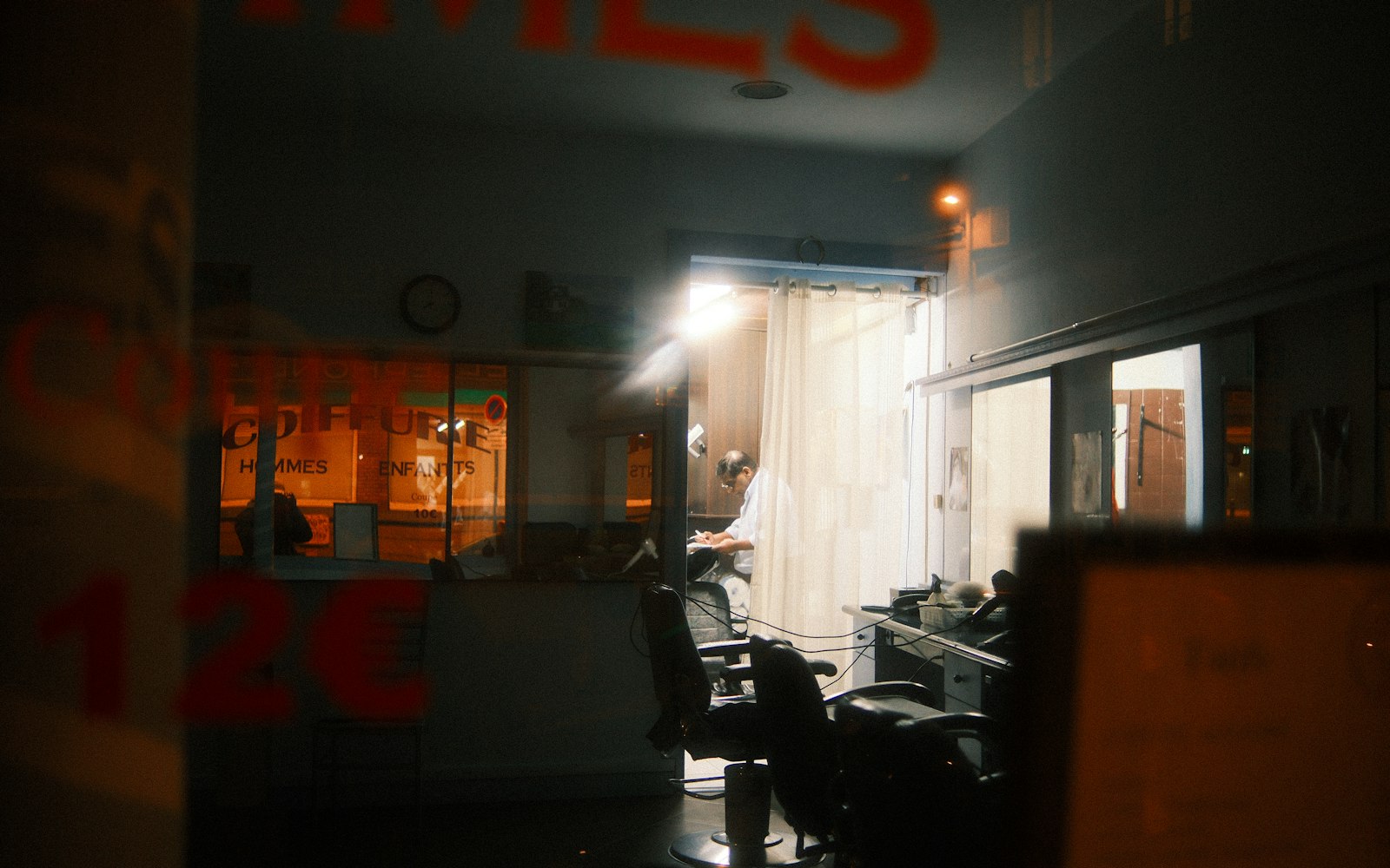 Quiet, dimly lit salon interior before the turnaround